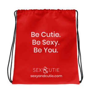 Cartera vermella amb missatge "Be Cutie. Be Sexy. Be You." per a dones confiades i sexys.