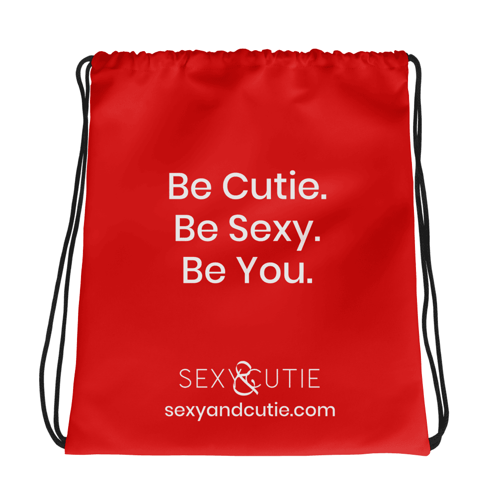 Cartera vermella amb missatge "Be Cutie. Be Sexy. Be You." per a dones confiades i sexys.