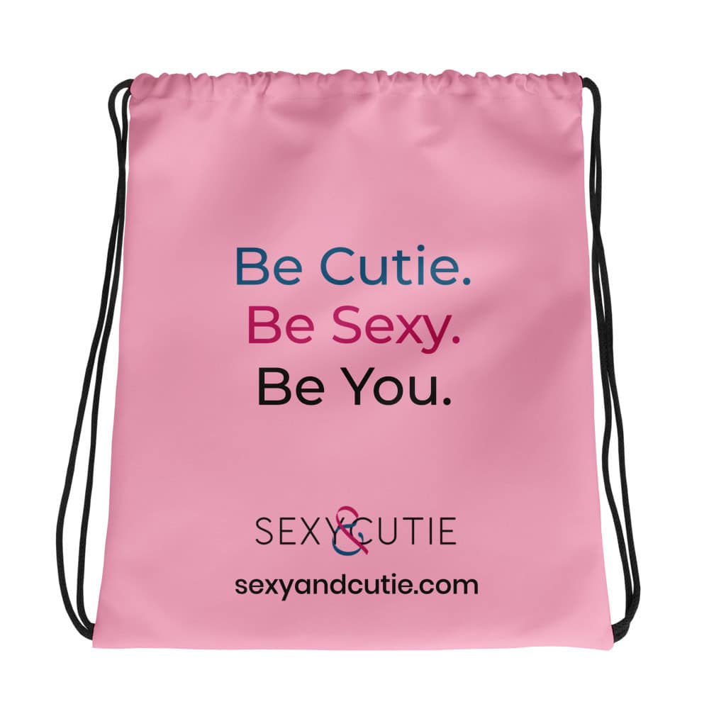 Samarreta rosa amb missatge "Be Cutie. Be Sexy. Be You." per a dones.