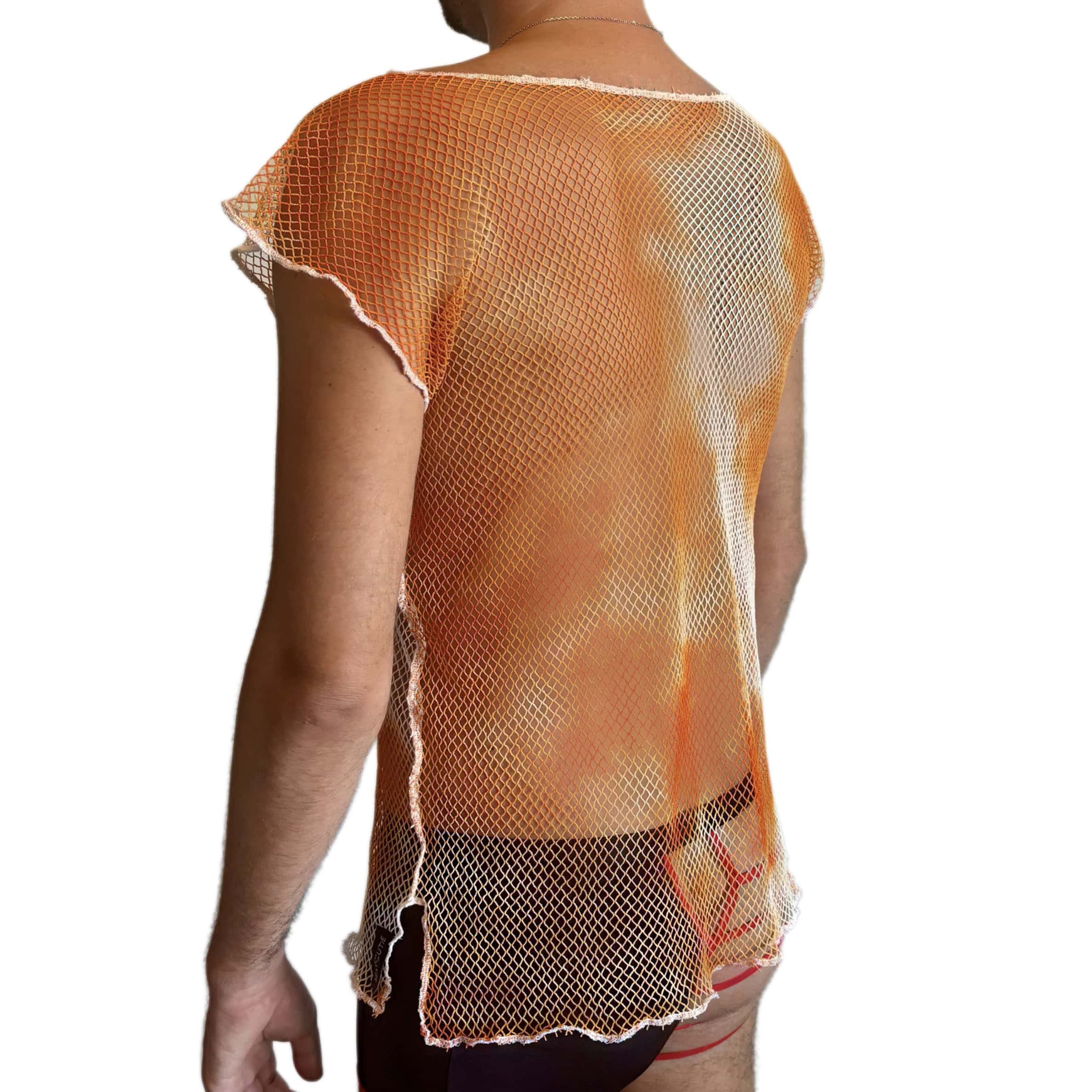 Woman wearing orange mesh top and shorts on white background.