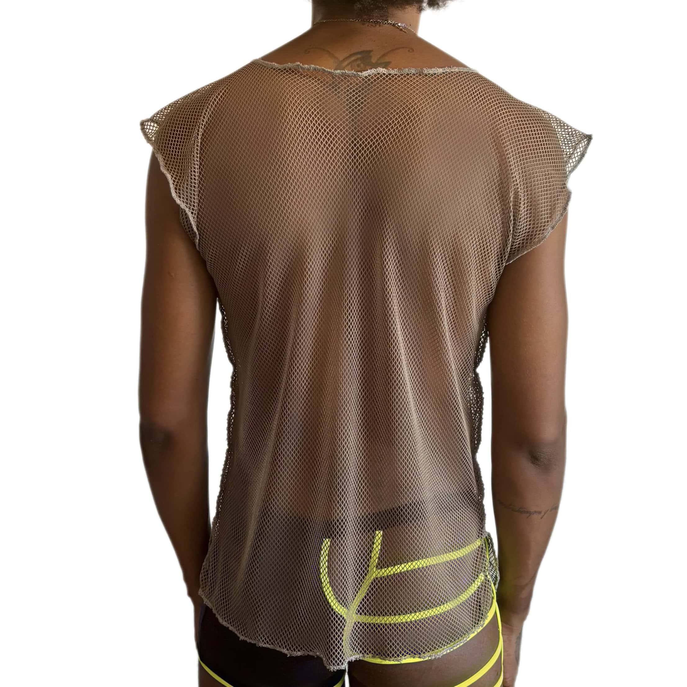 Woman wearing a mesh top and shorts in a sexy and daring style.