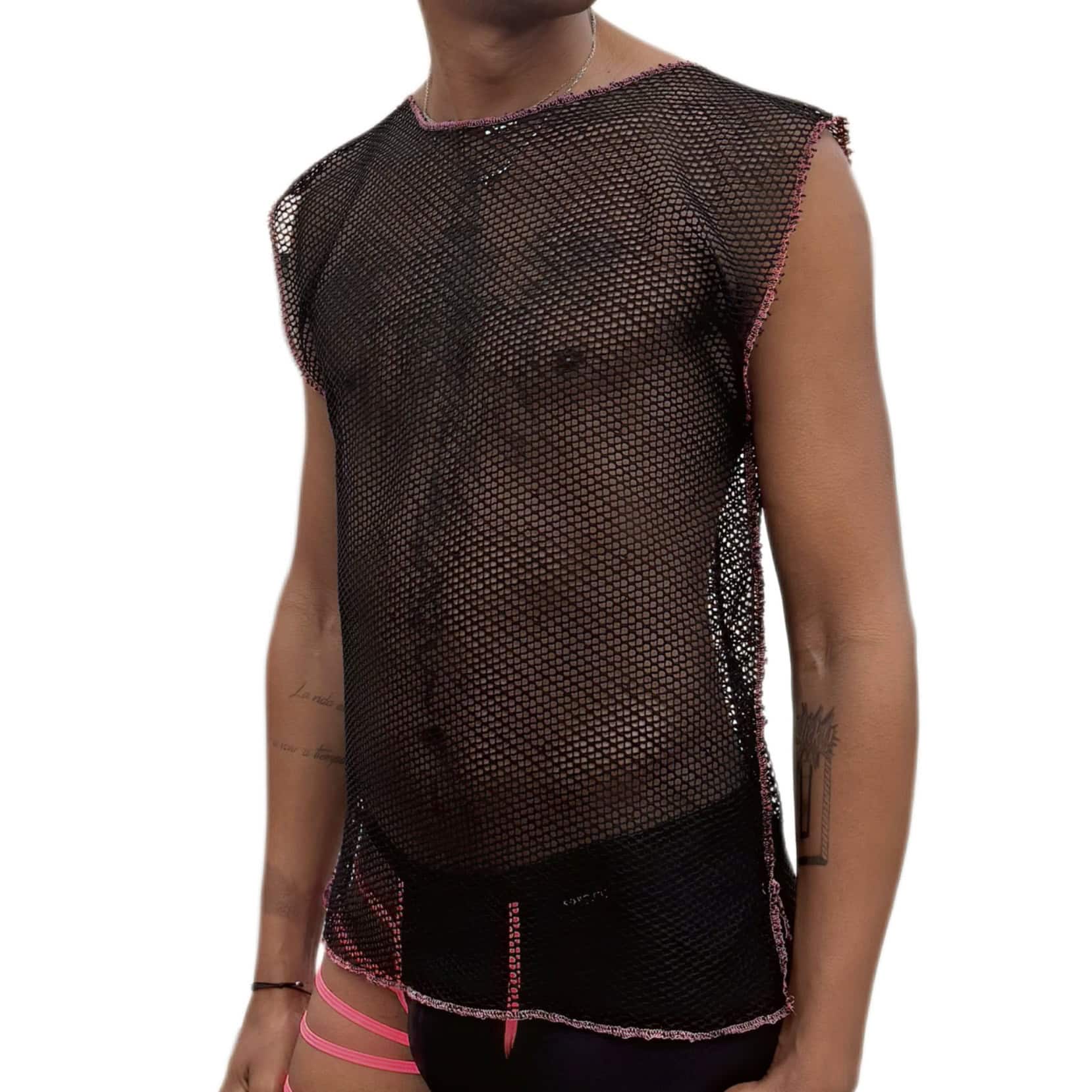 Boy wearing a black mesh shirt and pink shorts.